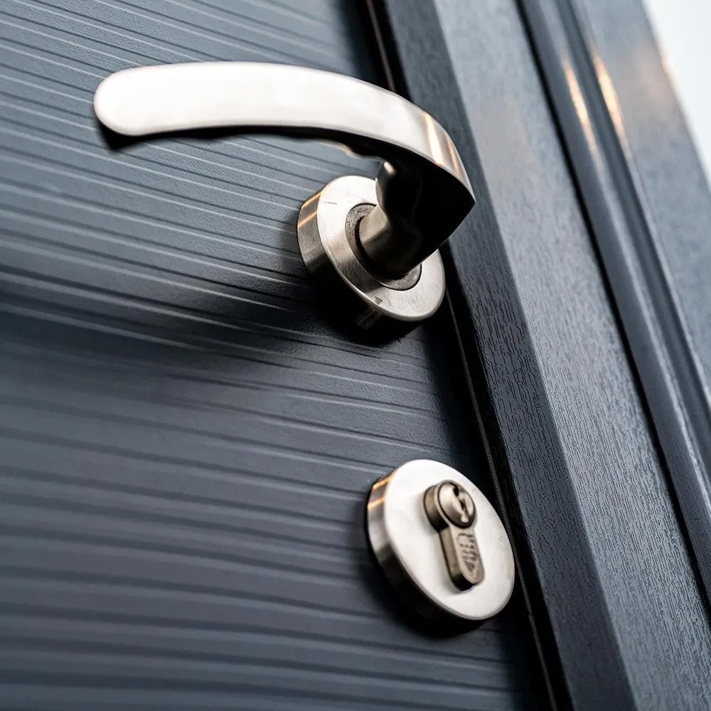 Brushed steel handle and cylinder lock on an anthracite Rockdoor